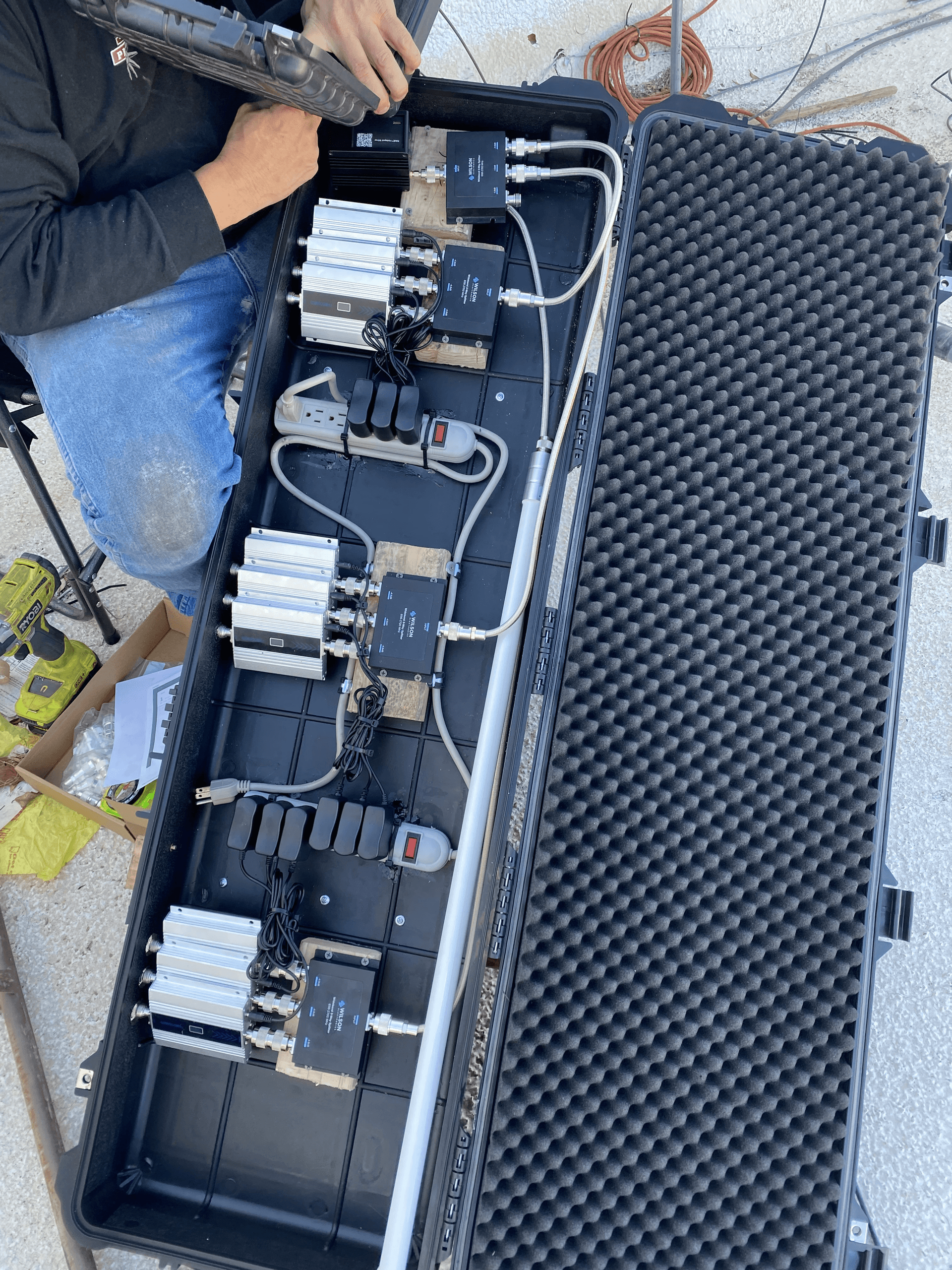 Weatherproof equipment enclosure showing Helium hotspot and RF components