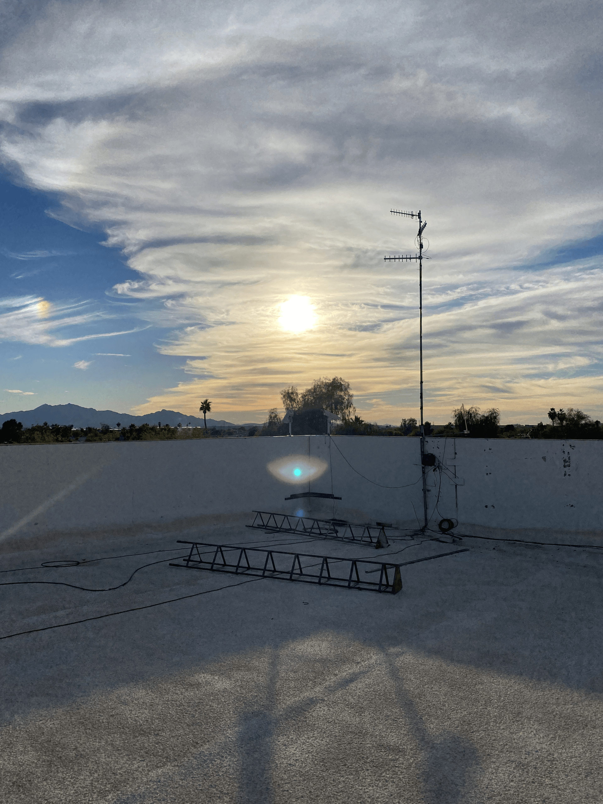 Professional rooftop antenna installation with proper grounding and weatherproofing